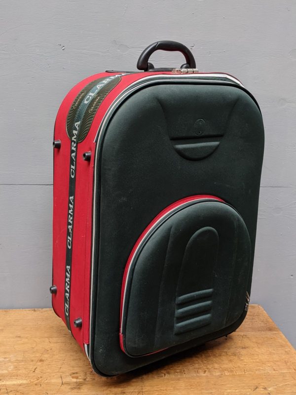red and black large suitcase