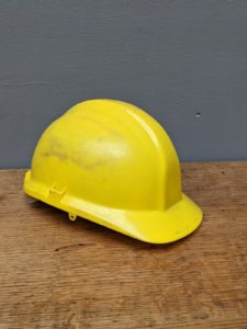 yellow plastic hard hat builders workmans