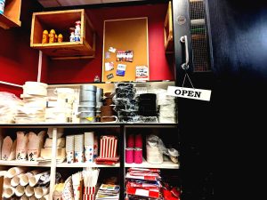 Shelving display of art department supplies and consumables. Including tapes, effects sprays and catering consumables.