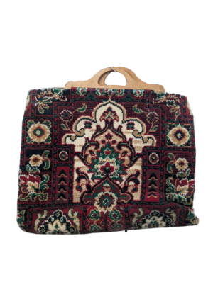 A traditional carpet bag with wooden handles