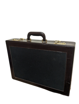 A dark leather briefcase with fabric panel and brass clasps.