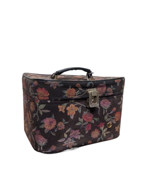 A vintage vanity case with a floral fabric and metal clasp